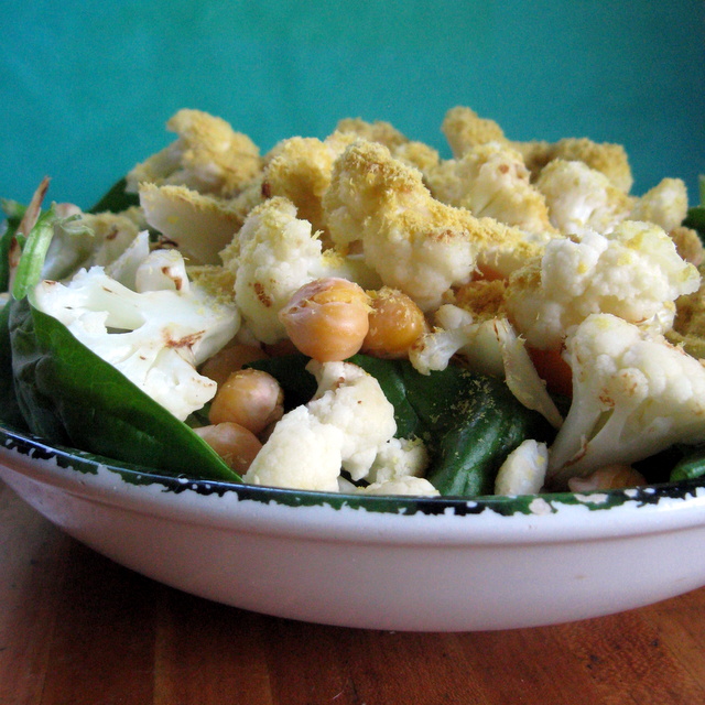 A bowl full of cauliflower and chick peas.
